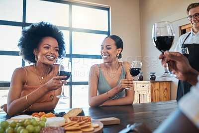 Buy stock photo Happy, smile and friends drinking wine and eating healthy, fresh and organic meal with toasted bread on a food table together. Diversity, glass, and relaxed people laughing at a luxury dining party