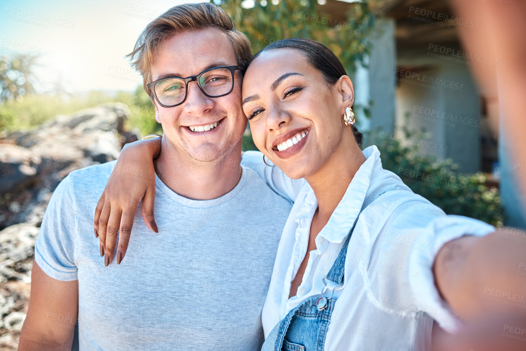 Buy stock photo Selfie of interracial couple in love, smile and romantic date with care, bond and relax in summer outside. Portrait of happy boyfriend and girlfriend on holiday with special vacation photo together