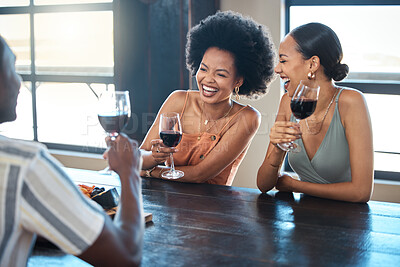 Buy stock photo Friendship, fun and celebration with a happy group bonding and drinking wine together at a restaurant. Diverse friends laughing, getting drunk and carefree, celebrating good news and freedom