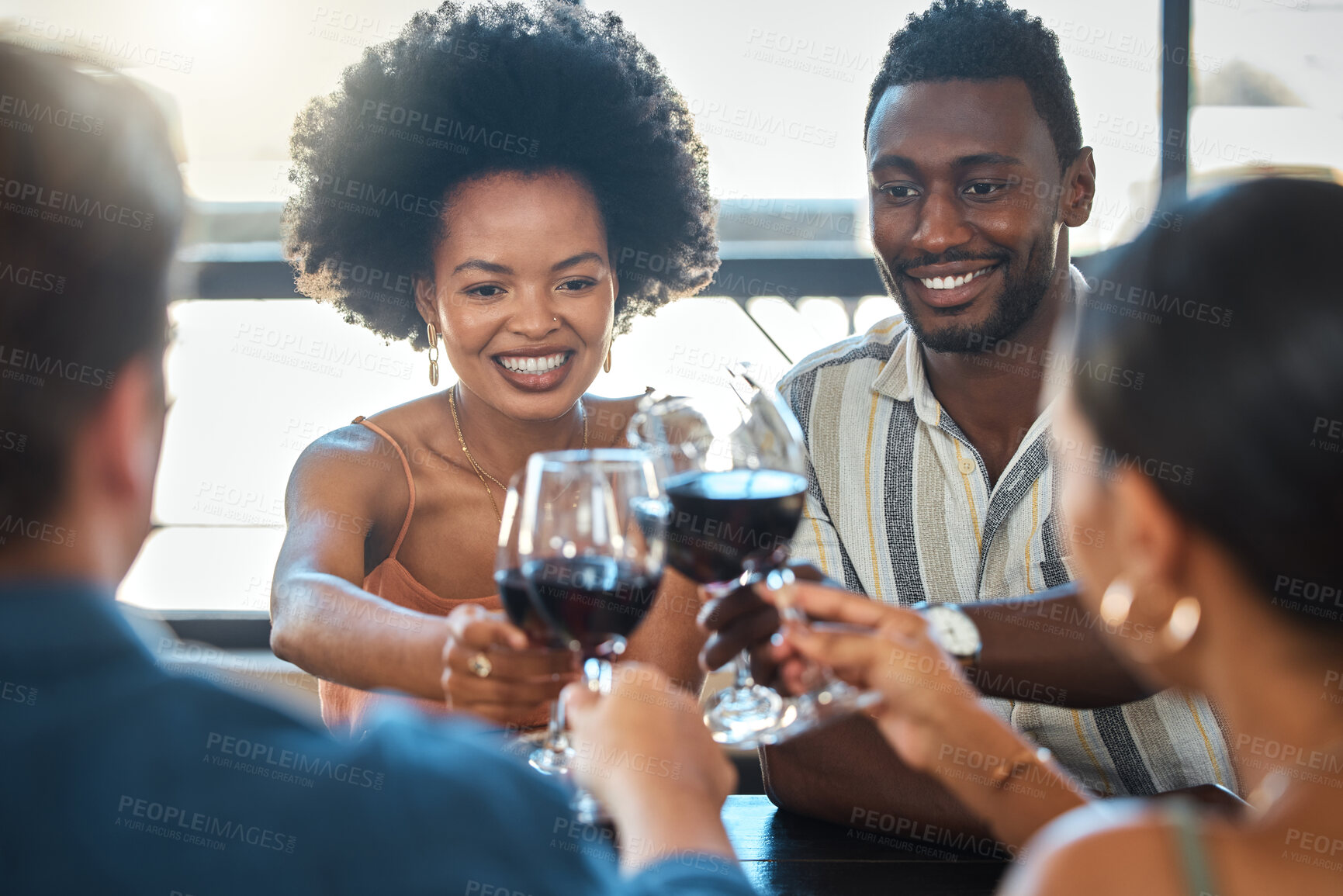 Buy stock photo Cheers, celebrating and winning friends drinking wine together at a dinner celebration in a restaurant. Double date of loving and romantic couples dining and having fun on a weekend