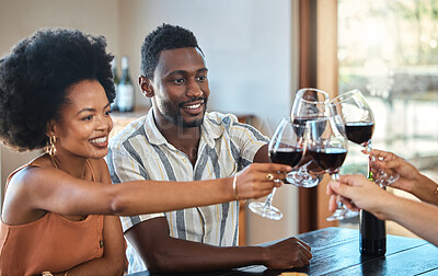 Buy stock photo Black couple celebrating their anniversary with friends, toasting and drinking red wine. Happy girlfriend and boyfriend bonding at a family gathering, together for an engagement or proposal 