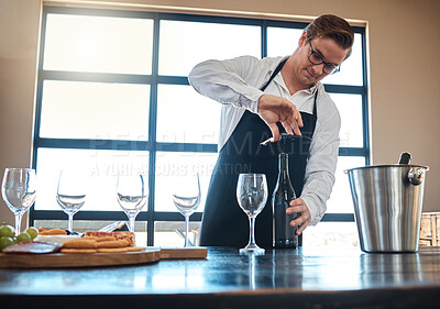 Buy stock photo Bartender with red wine tasting at luxury restaurant or vineyard and vintage alcohol bottle and glasses for fine dining, culinary or hospitality industry. Sommelier service with quality alcohol drink