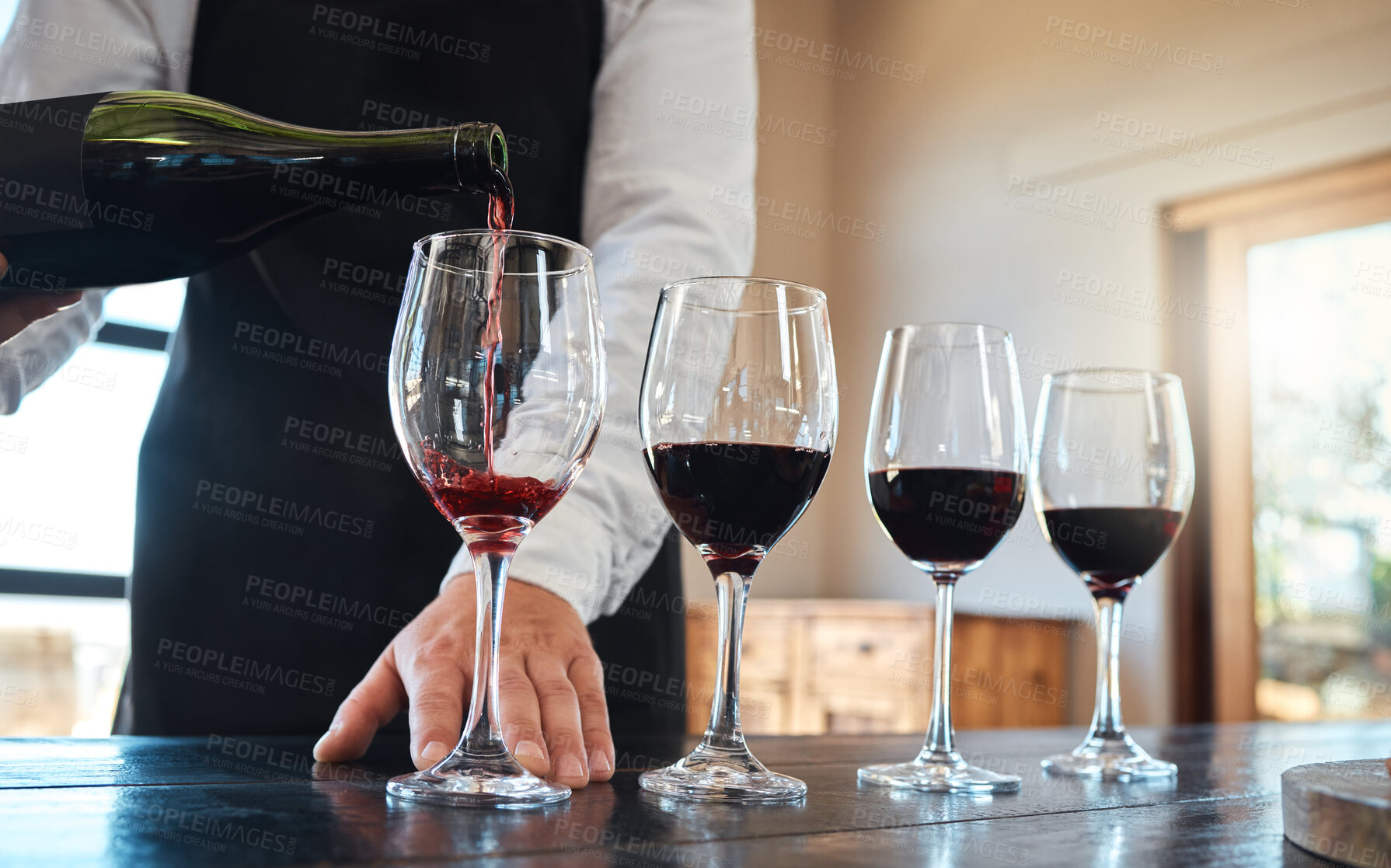 Buy stock photo Red wine tasting with luxury, quality alcohol in glasses for fine dining food, culinary or hospitality industry. Sommelier service or serving vintage alcoholic drink at a classic classy restaurant