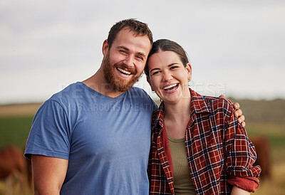 Buy stock photo Happy, carefree, and excited farmer couple standing outdoors on cattle or livestock farmland. Portrait of relaxed lovers relaxing on organic or sustainable land smiling and enjoying nature