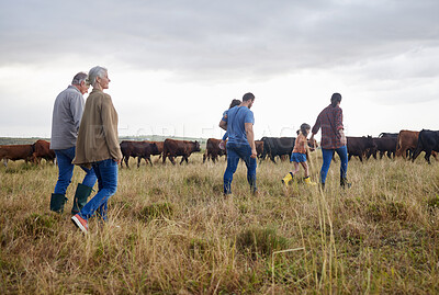 Buy stock photo Family together, cattle field and business with people you love. Countryside farmer parents walking in meadow with children to bond. Relationship with kids and sharing ranch for next generation.