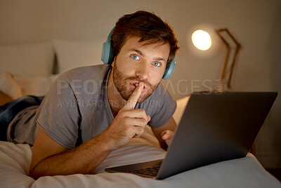 Buy stock photo Laptop, portrait and quiet hand gesture from man trying to focus. Insomnia or workaholic reading emails at night in his bedroom. Silence expression from person for silent environment while working. 