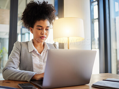 Buy stock photo Laptop, typing and serious business woman reading emails at desk. Formal, professional and worker with focus and commitment to her job. Office employee working on computer in a corporate workplace.