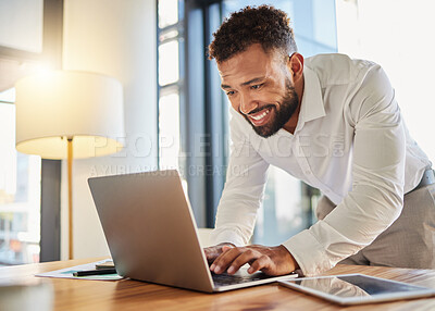 Buy stock photo Business man typing on a laptop at his desk in an office happy about writing a marketing growth strategy. Innovation, mission and vision by an employee working on a company development project