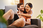 Happy and relax couple with a laptop on the sofa, live streaming movies or social media content with internet or home wifi in a living room. Love and smile of young man and woman on a couch together