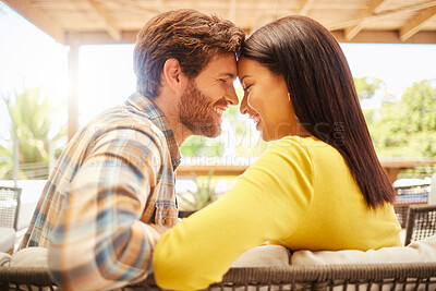 Buy stock photo Love, happy couple relax on a patio at new house or home on the weekend. Young married man and woman bonding on valentines day or marriage anniversary with intimate look before a kiss