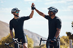 High five, celebrating and winning male cyclists having fun riding together outdoors in nature. Happy, excited and fit bicycle riders on a break after exercising and cycling in the environment