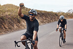 Winner, celebrating and winning cyclists cycling with his friend and racing outdoors in nature. Victory, joy and happy bicycle rider exercising on a bike for his workout routine on the road
