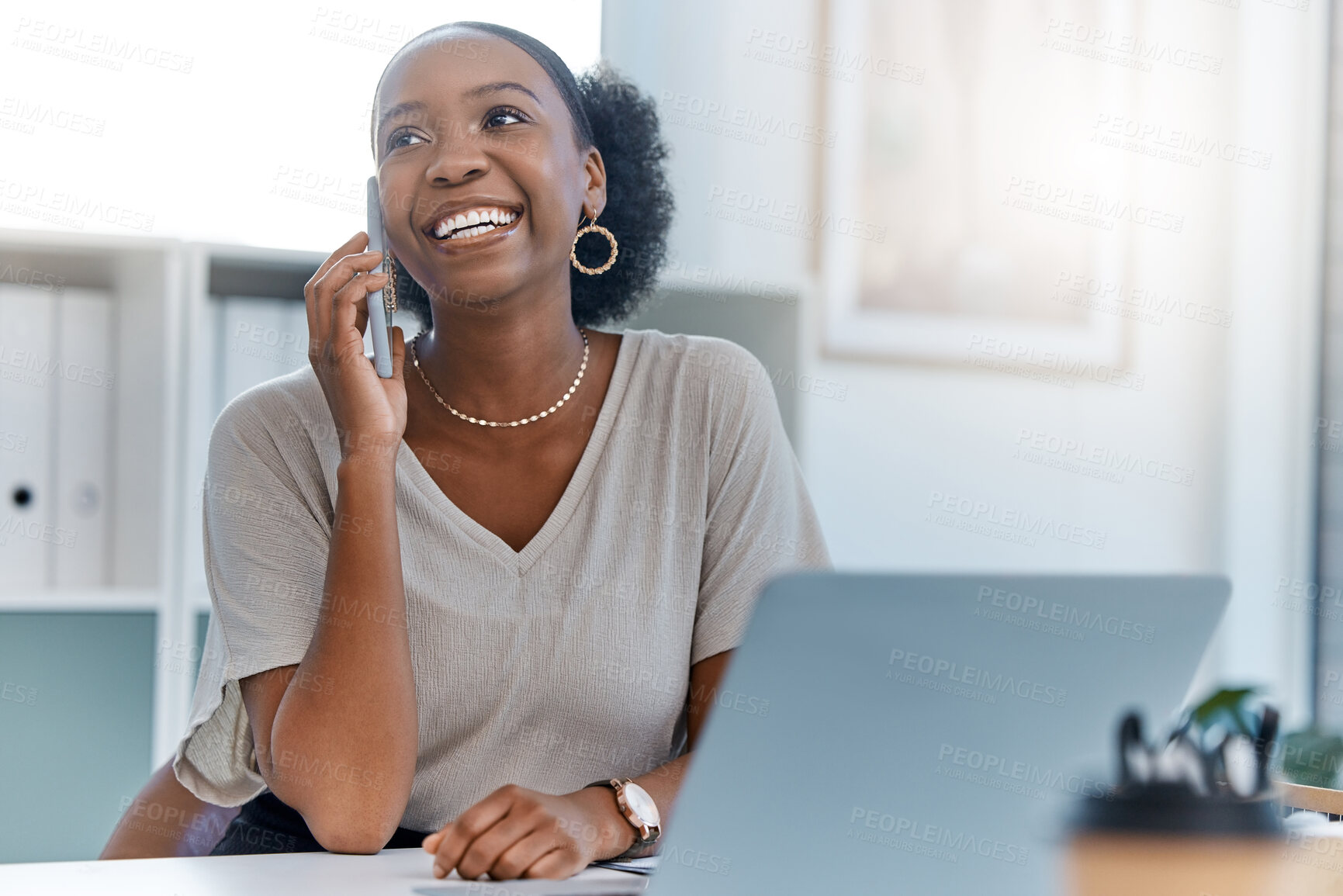 Buy stock photo Happy business woman smile talking on phone call or young entrepreneur answering cellphone while sitting in front of work laptop in an office. Female executive smiling and laughing at a funny joke