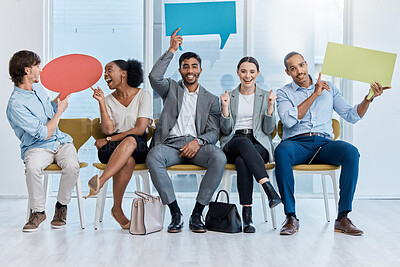 Buy stock photo Speech bubbles, voice and vote by business people happy and sitting in an office. A diverse team of employees holding empty comment signs or icons for social media company communication