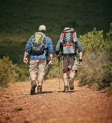 Buy stock photo Friends trekking nature while hiking in a forest together, being active and bonding outdoors. Active male travel on a path in the woods, enjoying a physical challenge while on trekking adventure