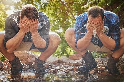 Buy stock photo Hiking men splash face with water for cool, relax and cleaning dirt when trekking on rock or hike in countryside forest. Earth, freedom after camping in nature and travel along mountain river or lake