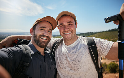 Buy stock photo Friends, brothers or hikers taking a selfie while hiking outdoors in nature sharing the experience on social media. Active, fit and athletic men take a picture or a photo while trekking