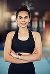 Happy training woman in gym, wellness athlete and exercise fitness. Healthy motivation portrait, sportswear equipment and slim person standing proudly and confident face after cardio workout 
