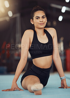 Buy stock photo Dance or gymnastics stretching, sports health exercise and split training before a fitness workout. Portrait of a young woman gymnast or dancer before a sport performance or competition at a gym