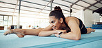 Exercise, flexibility and gymnastics girl stretching in the studio for a competitive sports. Woman Athlete training strength, body agility and balance fitness routine in a gym for competition event.