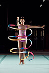 Ribbon dancer, woman and stage performance or practice at gym. Girl with flexibility does physical and artistic sports training. Balance, strong and gymnastic body of young athlete with discipline. 