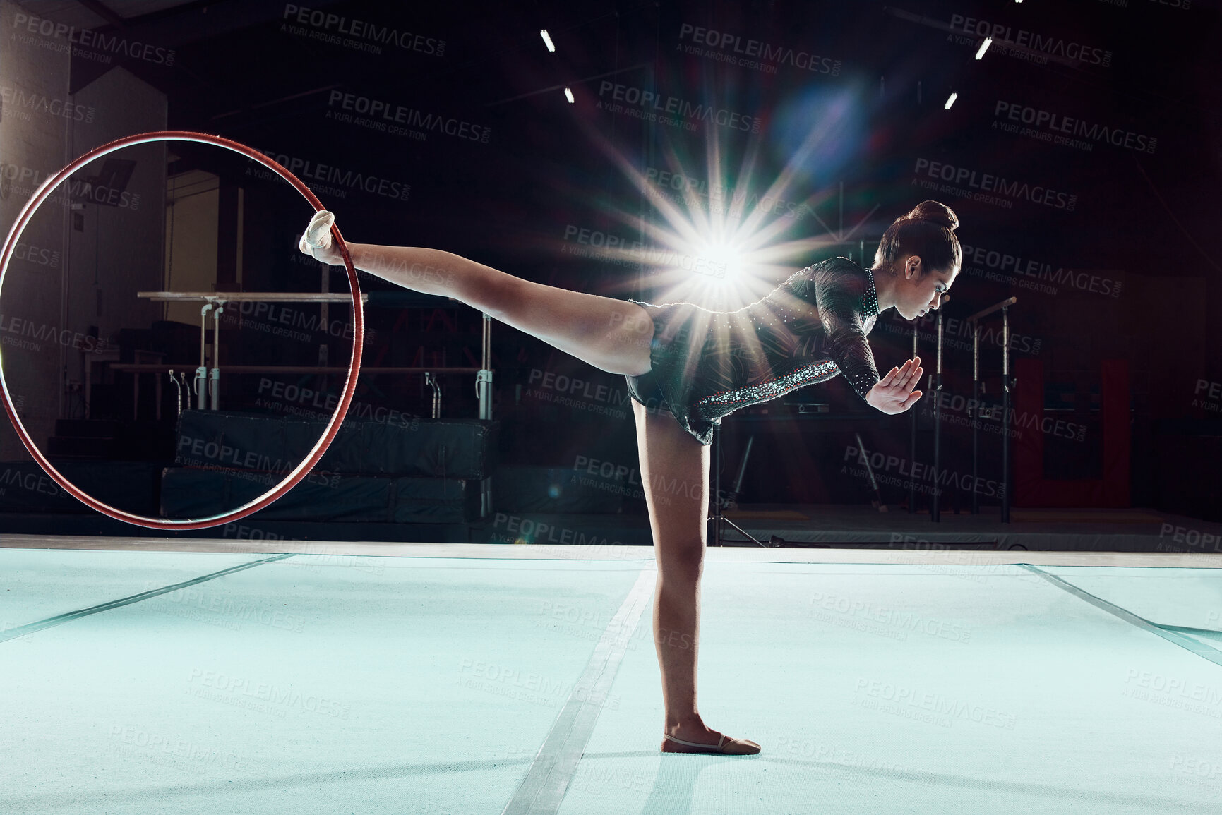 Buy stock photo Gymnastics, dance and sport with a woman gymnast performance on a floor with a hoop or ring. Olympics, rhythm and agile dancer performing a routine, recital or training for a competitive event