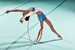 Sports woman, performance and balance ring for gymnastics show. Fitness girl doing artistic pose and stretch for acrobat stunt. Young and beautiful athlete in gym with hula hoop and flexible body.