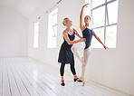 Ballet teacher, dancer and student training in a dance studio together. Fitness, learning and motivation, the support of a woman coach for young girl ballerina. Health, sport and  the art of dancing.