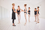 Ballet teacher and a group of dance students in a studio before training. Fitness, learning and motivation, a woman coach for happy, young ballerina girls. The sport, art and love of dancing in youth
