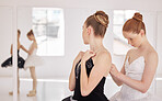 Ballet woman with help from girl with clothes before training, exercise or abstract dance routine. Ballerina student in studio for show with team or partner support at performance art academy school
