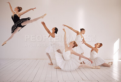 Buy stock photo Ballet, jump and dance class studio for professional sports woman. Female performance art students in training for ballerina recital. Elegant, passionate and energetic dancer girl flying in the air.