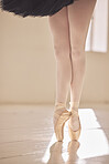 Ballet, feet and shoes of a ballerina or dancer dancing or training for a performance in a studio. Legs and toes of skilled and talented elegant performer practicing or rehearsal  in an art school