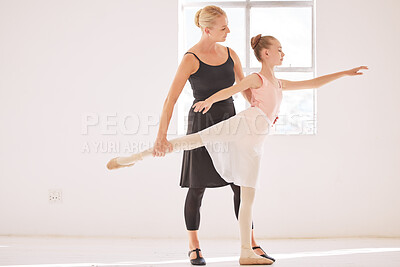 Buy stock photo Ballet teacher teaching a student in a dance class or studio at an art school for coaching or learning. Young girl ballerina or dancer training, stretching and practicing with support from a coach