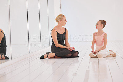 Buy stock photo Ballet education school teacher talking to learning student at performance art studio. Communication, motivation and help or support from woman or coach to creative dance academy girl relax on floor