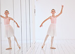 Happy ballet dancer girl stretching in a dance studio with mirror reflection and portrait. Smile face of a learning child dancing in a class in pink princess costume for a performance