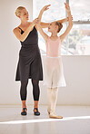 Trust and support from ballet teacher and girl in dance academy dancing or training for a art performance. Young happy student child smile at her coach her while stretching and learning in a studio