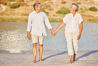 Buy stock photo Love, walking and senior couple on a beach lake together for calm, relax and romantic ocean, water or sea date. Elderly happy people, man and woman smile while living pension and retirement lifestyle