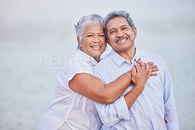 Buy stock photo Senior love, hug and portrait couple on beach in trust hug, security and safety on retirement holiday, vacation or break. Happy couple, people smile and elderly man and woman bonding close together