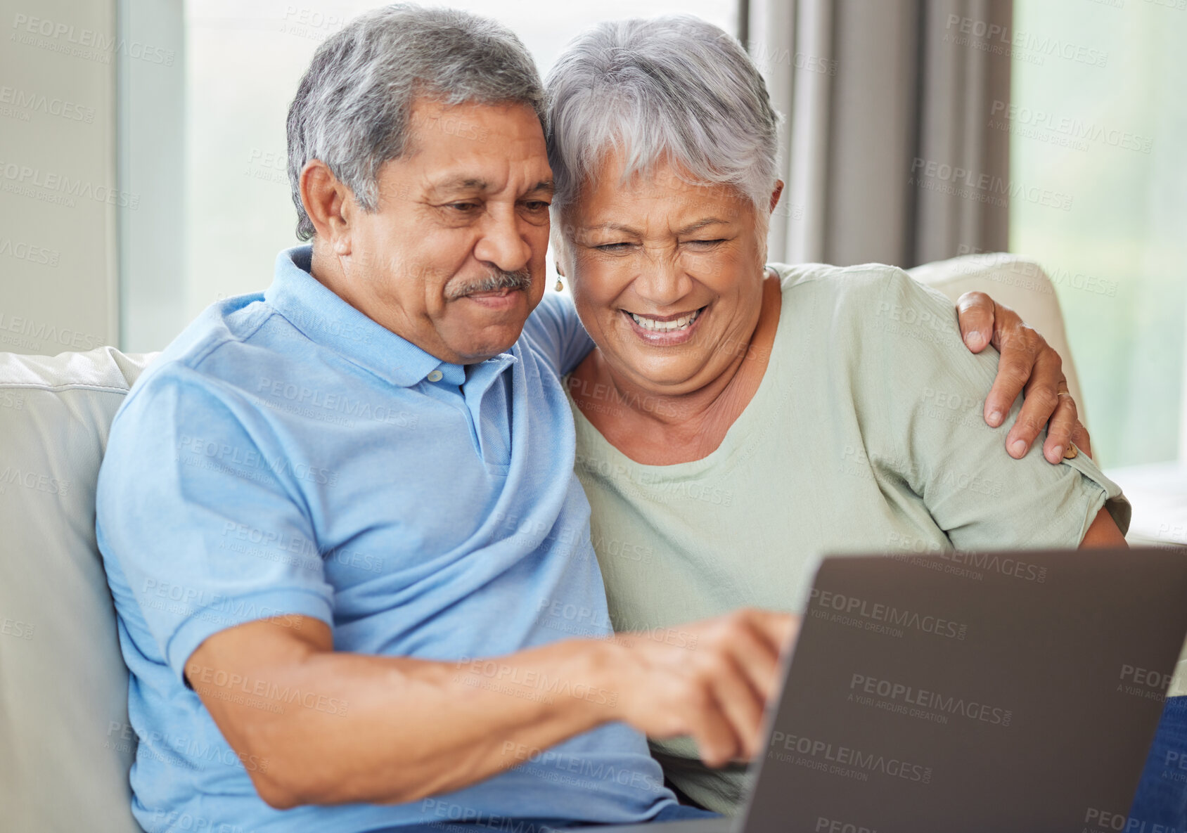 Buy stock photo Elderly couple laptop on video call, social media or internet on their laptop on living room sofa. Relax senior man and woman watching or reading news, email or funny message online together at home 