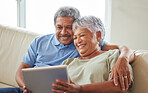 Couple, tablet and communication on social media or video call with elderly husband and wife relaxing on the couch at home. Senior man and woman reading retirement savings insurance on a banking app