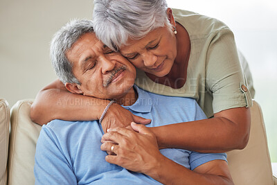 Buy stock photo Sad or unhappy senior couple hug, comfort or support in a living room at home. Elderly husband suffering from depression problem after retirement consoled by his wife with love in the living room.
