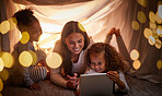 Mother, children and tablet with happy family watching online tv, learning with education games and reading ebook at night at home. Internet and enjoying live stream movies with cartoon subscription