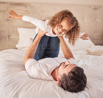 Buy stock photo Family, love and support while girl and father have fun in a bedroom at home while playing a game. Happy and excited child with dad after adoption and airplane flying with energetic single parent