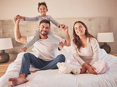 Buy stock photo Fun family portrait, parents or girl playing in home bedroom for man, woman or girl in happy family. Smile, love or relax couple, bonding mother or father carrying child on shoulder in house interior