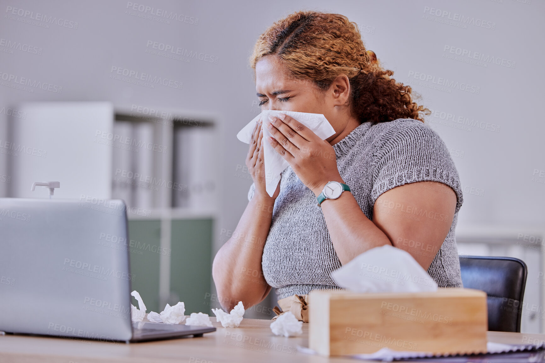 Buy stock photo flu, covid and sick corporate employee suffering with a cold or flu, working on laptop, blow nose or sneezing in an office. Young assistant experience allergy, sinus, illness or disease symptoms
