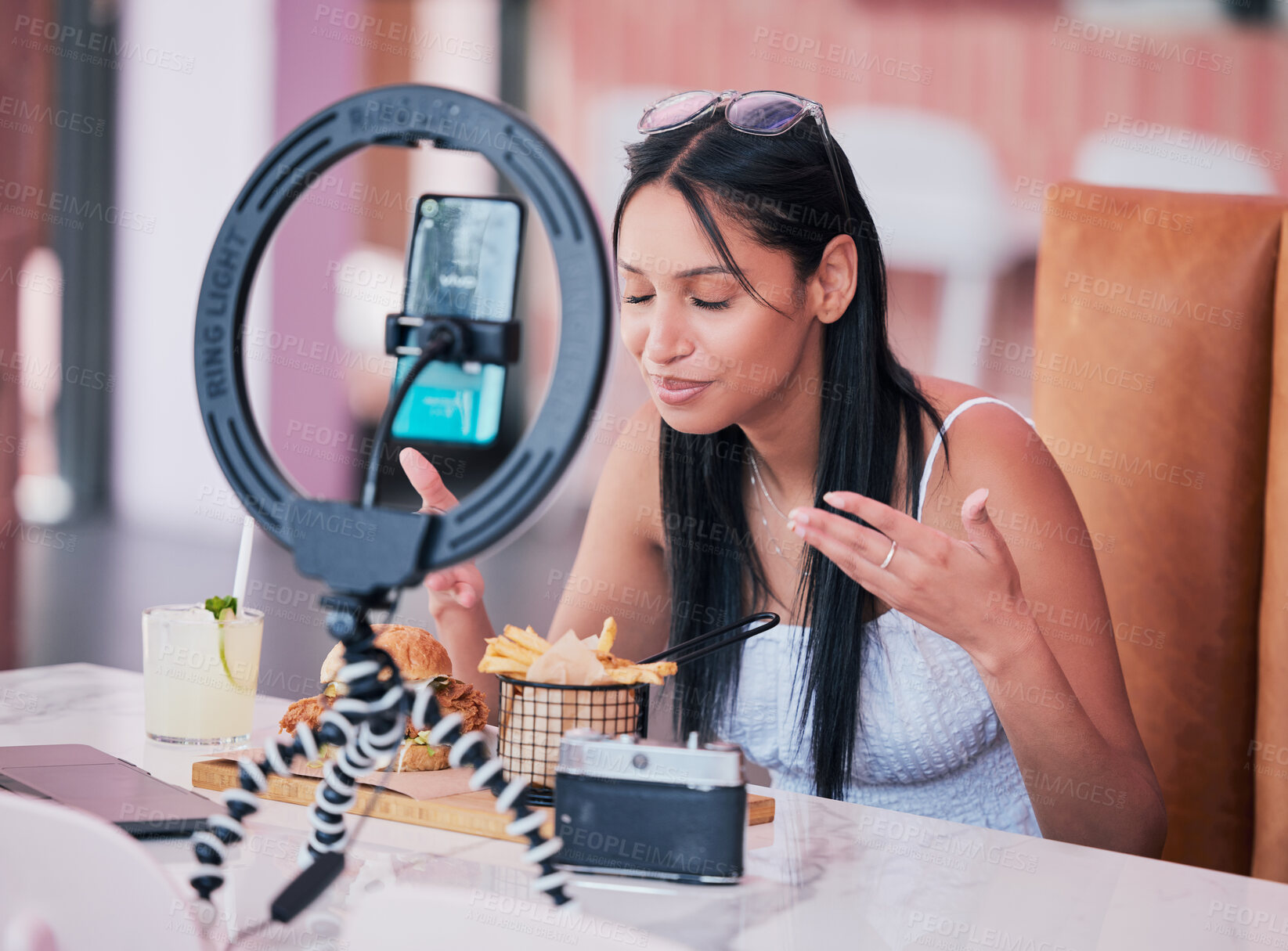 Buy stock photo Social media influencer, smartphone and ring light for new fast food restaurant test for internet, web and followers. Creative online communication with digital mobile tech for startup video blog