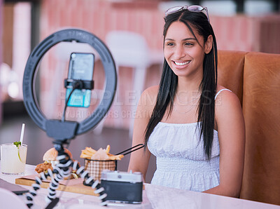 Buy stock photo Social media influencer online video of food at cafe, smartphone technology with mobile light lifestyle vlog. Happy young girl in restaurant with film camera, woman eating fries, burger and cocktail