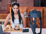 Food influencer, internet speaker at restaurant with camera and recording cooking review social media video. Digital cuisine web content creator or brand ambassador live streaming to online audience.