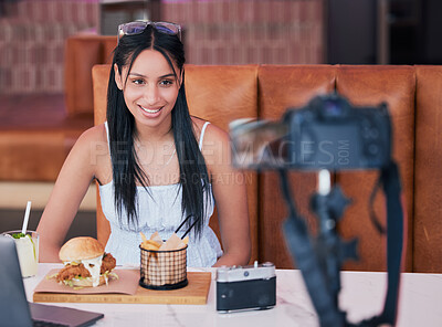 Buy stock photo Food influencer, internet speaker at restaurant with camera and recording cooking review social media video. Digital cuisine web content creator or brand ambassador live streaming to online audience.