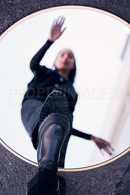 Buy stock photo Mirror, reflection and fashion shoes of a woman standing on a blur vision of herself in the street outdoors. Female person on glass with shoe in reflect for self awareness in edgy, cool and style.